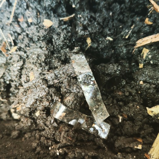 Shredded plastic from envelope windows