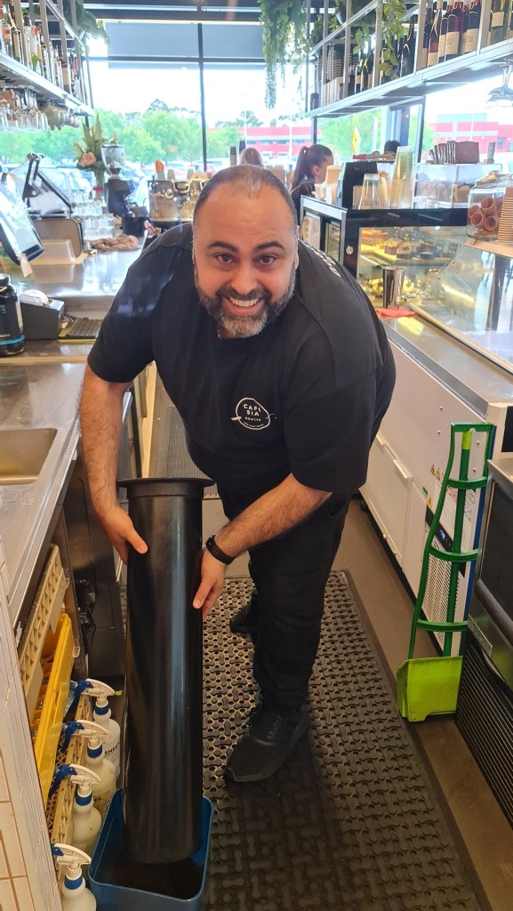 Gabby is happy to give us Cafe Sia's waste coffee grounds.